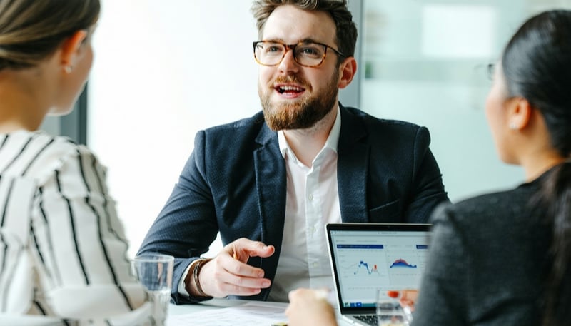 A financial advisor discussing HubSpot CRM strategies with a wealth management client