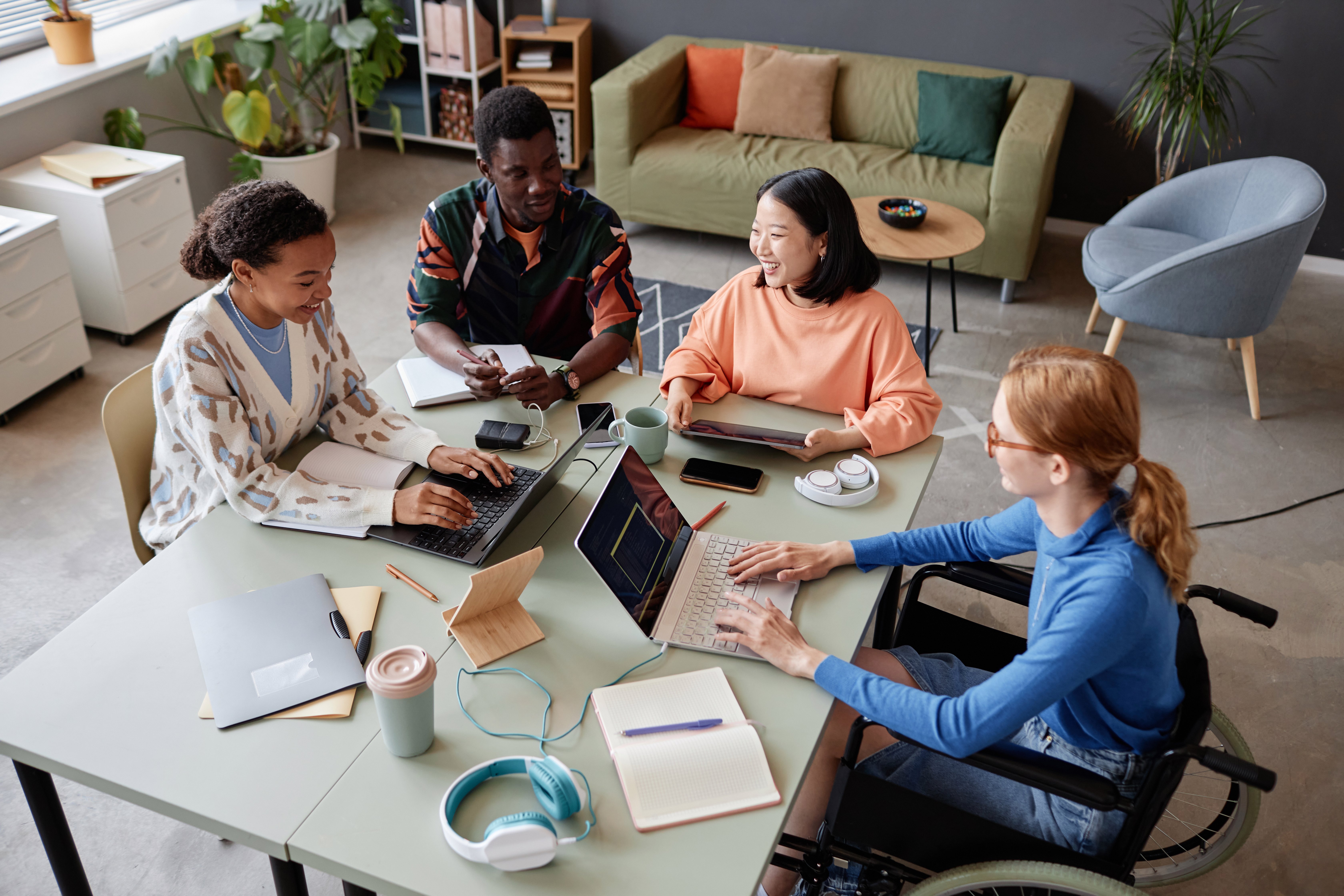 diverse-group-young-people-enjoying-work-together-meeting-it-office
