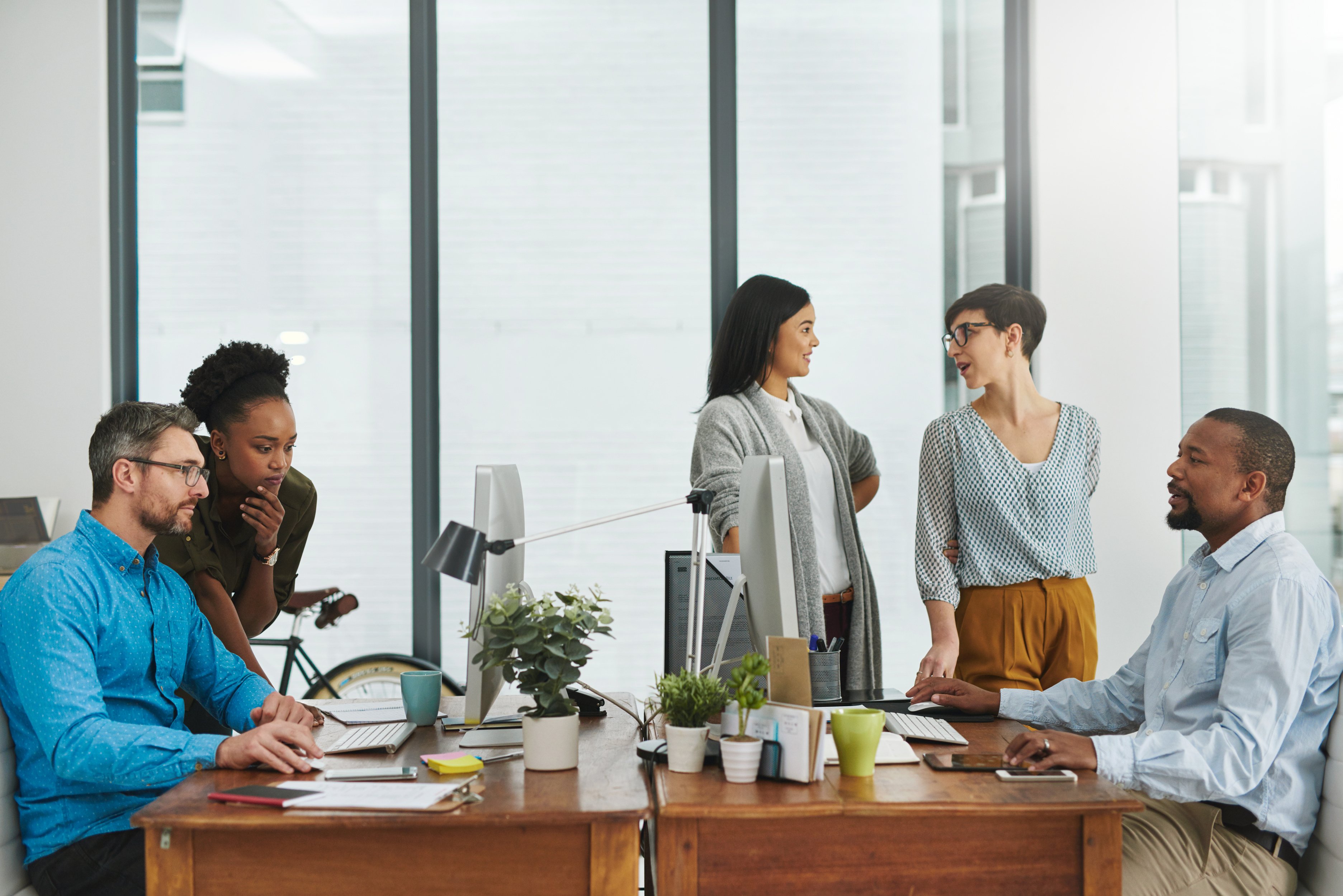 hustle-bustle-modern-office-cropped-shot-group-colleagues-working-their-office